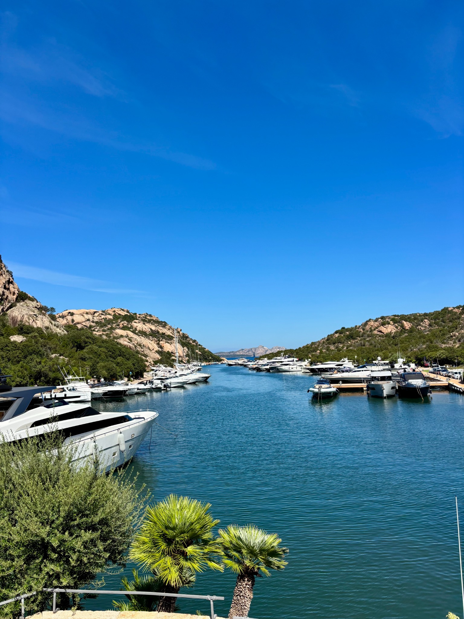 Boats lining a marina on the Sardinian coast
